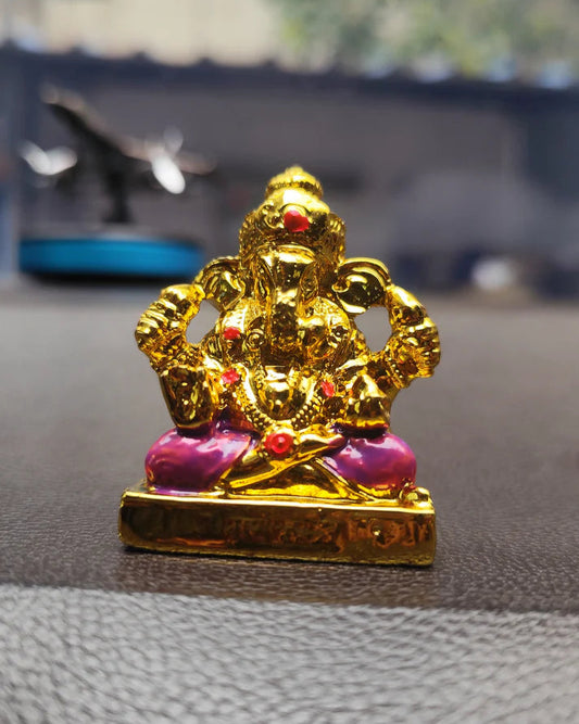 Elegant Golden Lord Ganesha Idol with Pink Dhoti